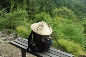 A conic straw hat and a staff are common equipment of pilgrims in Japan