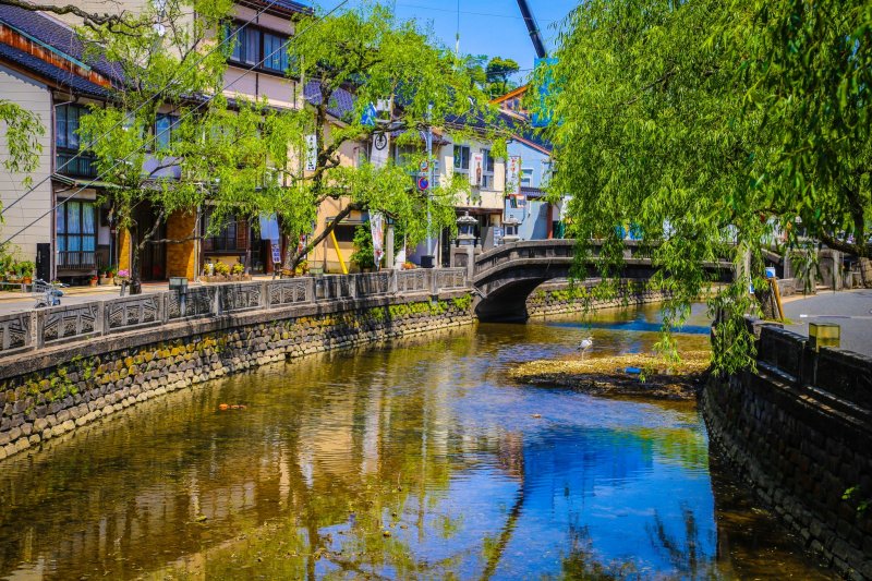 Willow trees and stone bridges are a typical view in Kinosaki Onsen.  