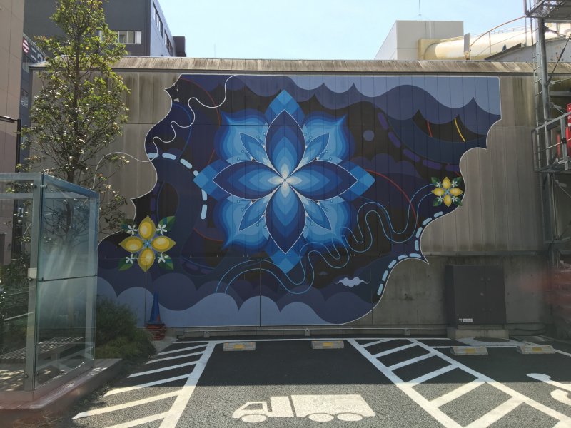 A collaborative work by HITOTZUKI, which stands for the sun and moon - this artwork is just opposite the sumo wrestler