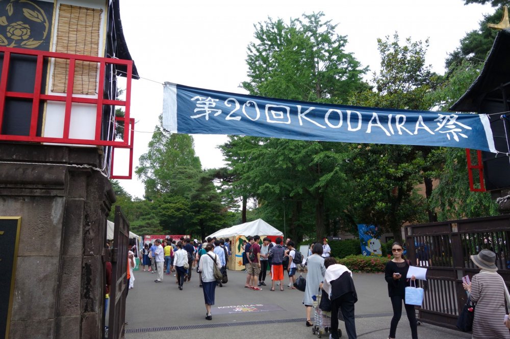 A telling festival banner hangs across the entrance to the university's main campus
