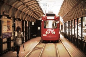 catching the street car in Susukino