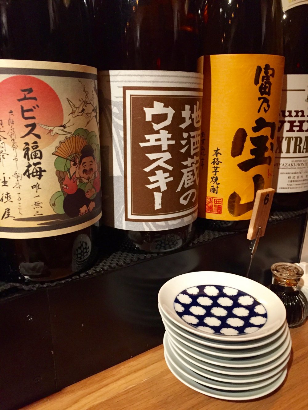 Big bottles with sake, whiskey, and plum liquor