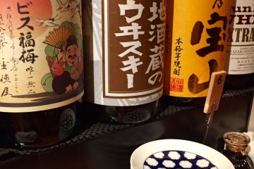 Big bottles with sake, whiskey, and plum liquor