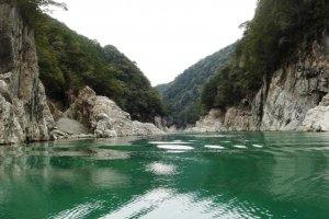 Emerald-green waters and steep cliffs on both sides of the gorge