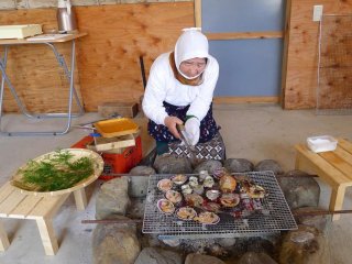 Lunch is served by women in traditonal divers' outfits