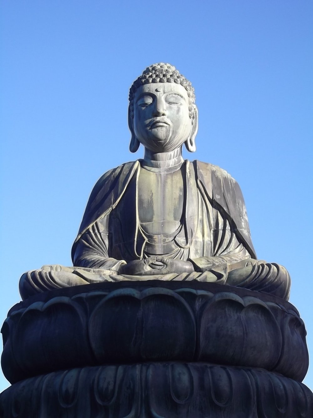 A close-up of the Buddha's serene posture and face