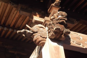 Carved airborne beasts at the worship hall