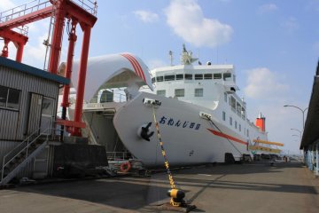 An Orenge ferry with its bow up