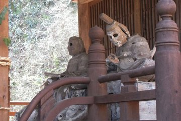 Old eyeless wooden statues