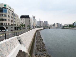 Tenma River, flanked by open walkways and parkland.