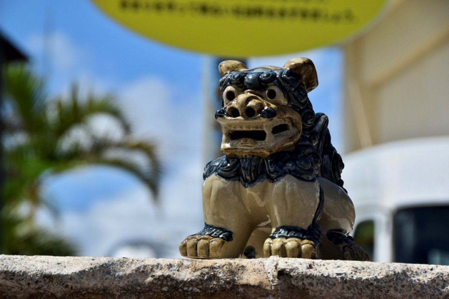 Shisa, the iconic Okinawan Lion Dog, watches over the rustic laneways at Aharen Beach