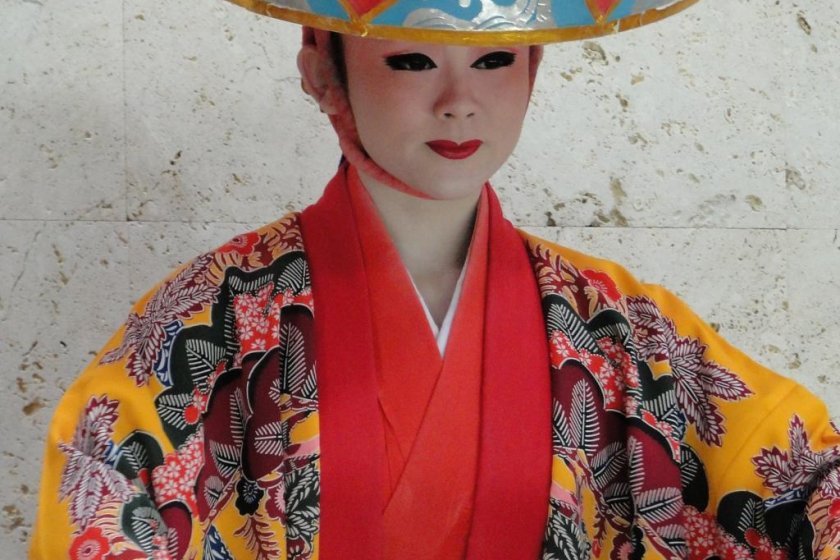 A woman performs the classical yotsudake dance at Urashima Dinner Theater