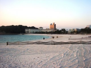 A long white sandy beach awaits guests at Shirahama Onsen