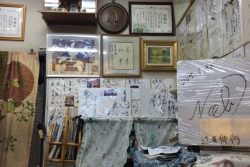 The walls of the restaurant, decorated with fan signatures