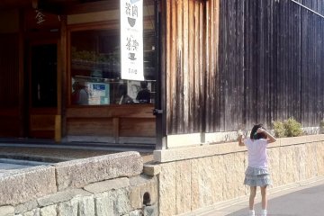 A little girl skips on the street oblivious to the crowds at Sannenzaka and Ninenzaka Kyoto