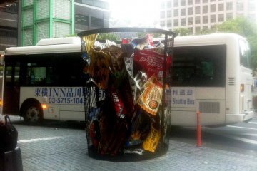 Toyoko Inn Shinagawa Tennozu Isle Tokyo Shuttle Bus with a huge art sculpture of a rubbish bin, just in case the super clean Japanese forgotten what trash looks like