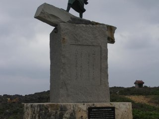 This statue along the walking paths at Cape Zanpa points directly at the end of Cape Zanpa