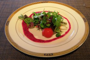 Seasonal-local vegetables with dragon fruits dressing on a classical French plate