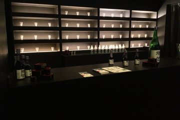 The chic sake bar, in full swing at night. 