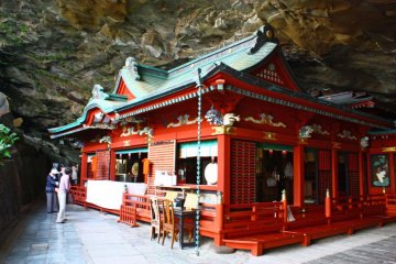 The main building fits snugly in the cave. A pair of breast-shaped rocks around the back of the building are thought to bring luck to pregnant women, who can drink the fresh water that drips from them.