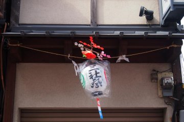 <p>Lanterns bearing the words Sanja Matsuri are often seen hung around doorways of shop houses.</p>