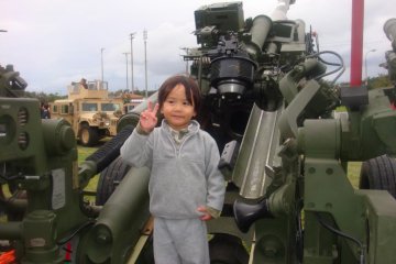 The reviewer's son posing with a howitzer