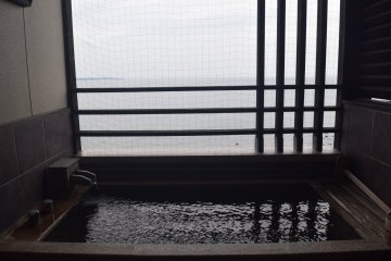 Some rooms include an open air balcony onsen with Beppu Bay views