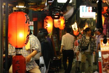 The Alley: A blaze of neon and the glow of red lanterns