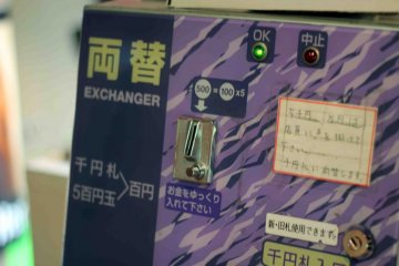 Use the change machine to get more 100 yen coins.