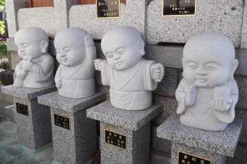 Cute baby-faced statues