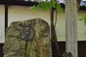 Main memorial statue and little monument to Kenji Miyazawa.