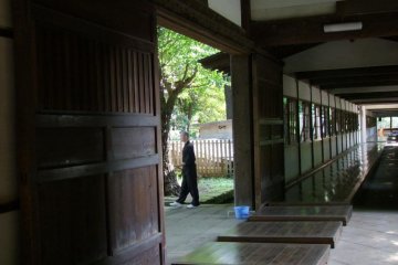 Monk cleaning the grounds.
