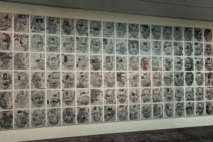 The room is filled with drawings of Yoshimura&#39;s face on newspapers.
