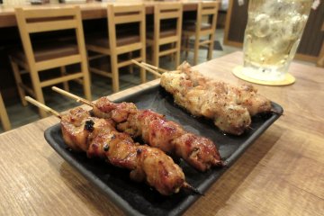 Yakitori (grilled skewered chicken) with different sauces - their specialty