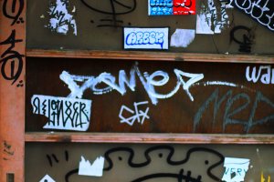 A small collection of grafitti and sticker art.