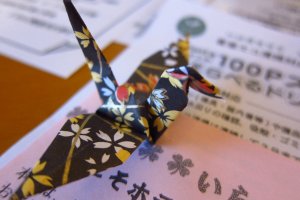 Paper origami crane to greet you in the room