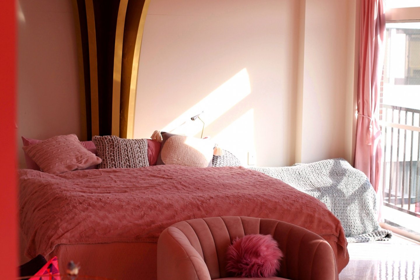 Plush luxury bed with dramatic sakura installation