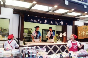 Walking through the "shoutengai" store street,  traditional candy  makers cut away rhysimically as if they were doing a coordinated dance!