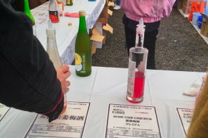 Umeshu Festa: One of four tables containing 166 bottles of Plum Wine and Sake