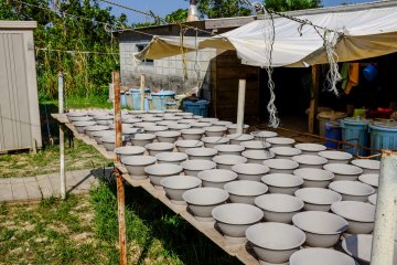 Throughout the village there are pottery bowls drying in the sun
