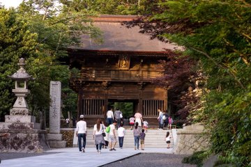 The main temple gate surrounded by late summer foliage
