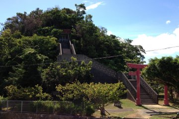 <p>This shrine built into the densely covered hill is the focal point of Sukubu Park</p>