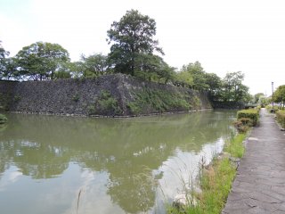 The moat surrounds the castle walls