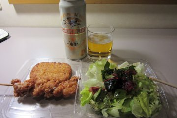 Croquettes, salad and beer bought in a Japanese convenience store, or 'combini'