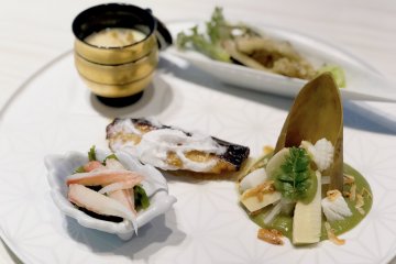 Fish Dishes: Black Cod Grilled with Saikyo Miso, Tempura of Sansai Vegetables, Soup with Salmon and Seasonal Vegetables, Marinated Bamboo Shoots with Herbs, Sakura Shrimp and Squid, Chawanmushi with Abalone