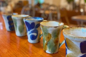 Local pottery is used to serve beverages in