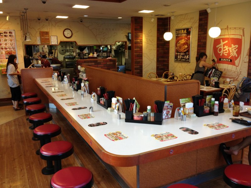 <p>Sukiya locations in Okinawa seem to have the same store layout; there&#39;s about eight tables to sit at and a dozen bar stool counter top spots to dine at</p>