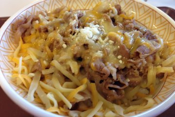 <p>This Gyudon beef bowl is available in many sizes and is shown here topped with cheese</p>