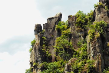 The rock at the very left is called Saru-no-tobi-iwa (monkey jumping on the rocks) and is located right by the minshuku - can you see the monkey's face from the side?