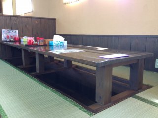 There are regular tables to sit at, tatami tables, and these tatami tables with room to dangle your feet down below